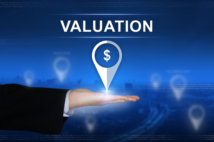 financial valuation button on blurred background